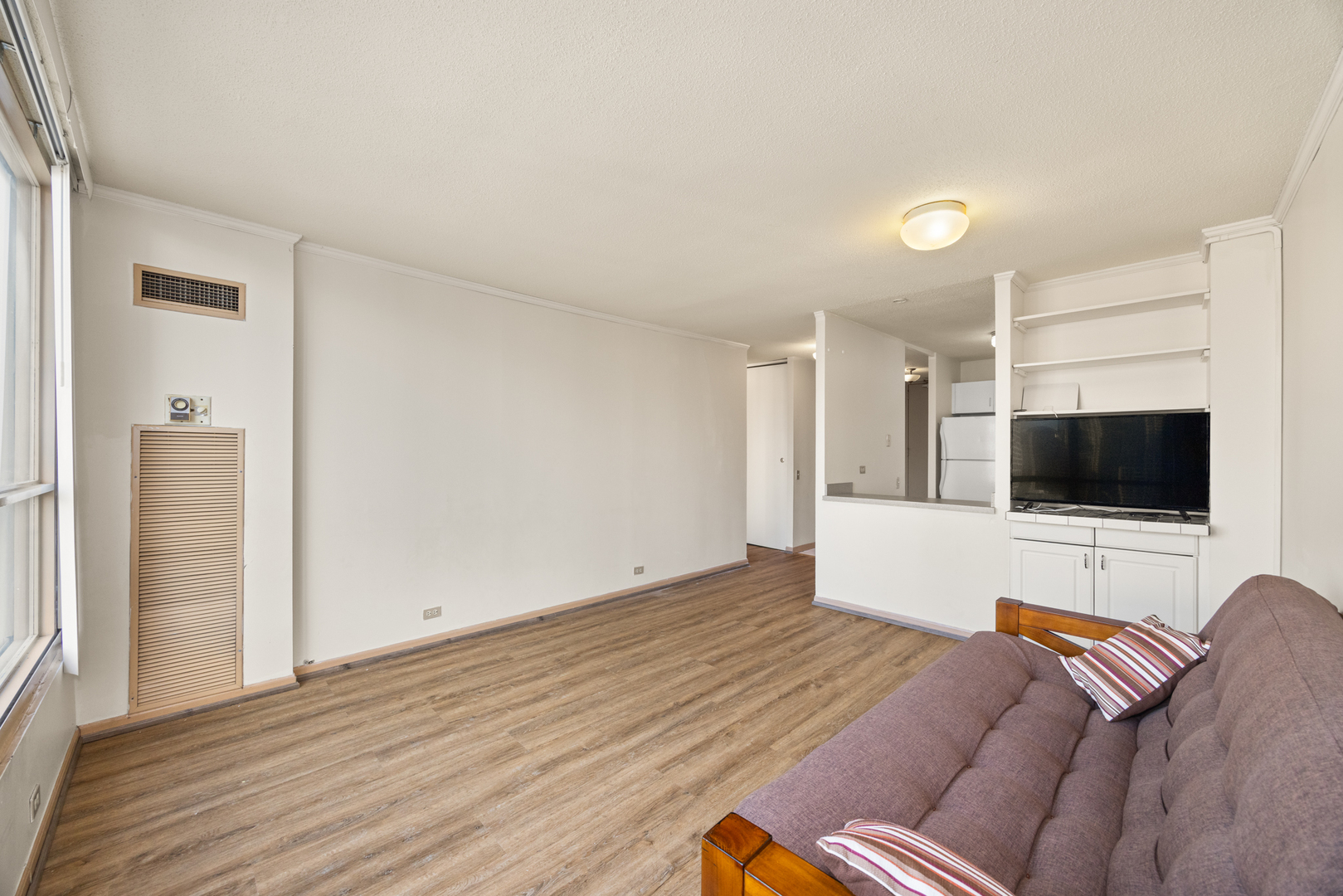 405 North Wabash Avenue, Unit 2801 Chicago, IL 60611 - Photo 21 of 29 a living room with furniture and a flat screen tv