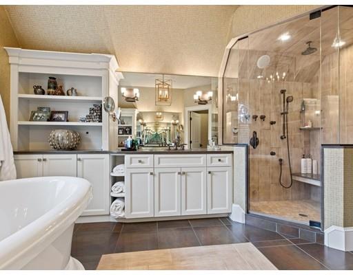 14 Lehigh Road Wellesley, MA 02482 - Photo 20 of 27 a bathroom with a double vanity sink a mirror and a shower
