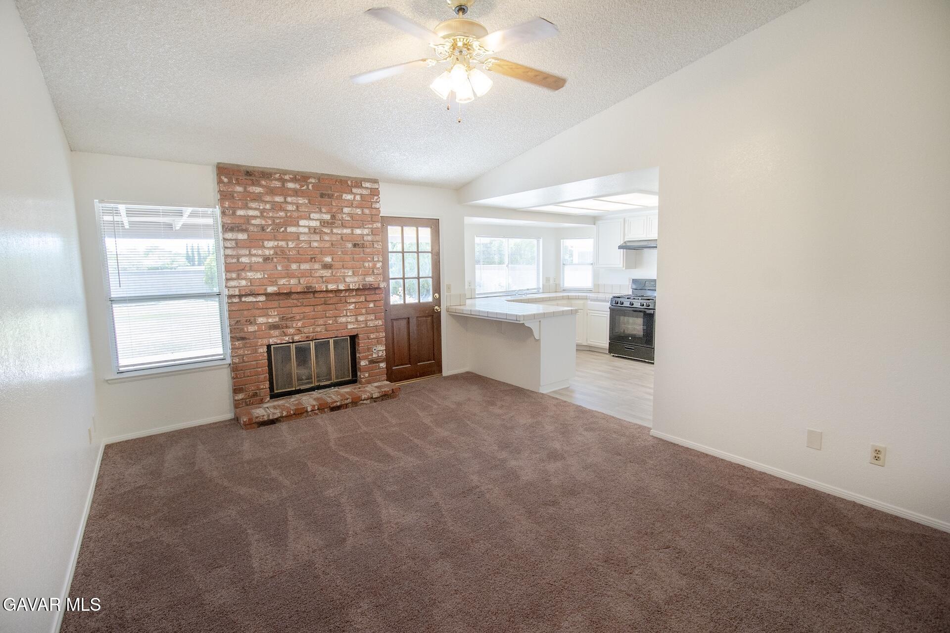 44318 33rd Street West Lancaster, CA 93536 - Photo 17 of 29 a room with chandelier and window