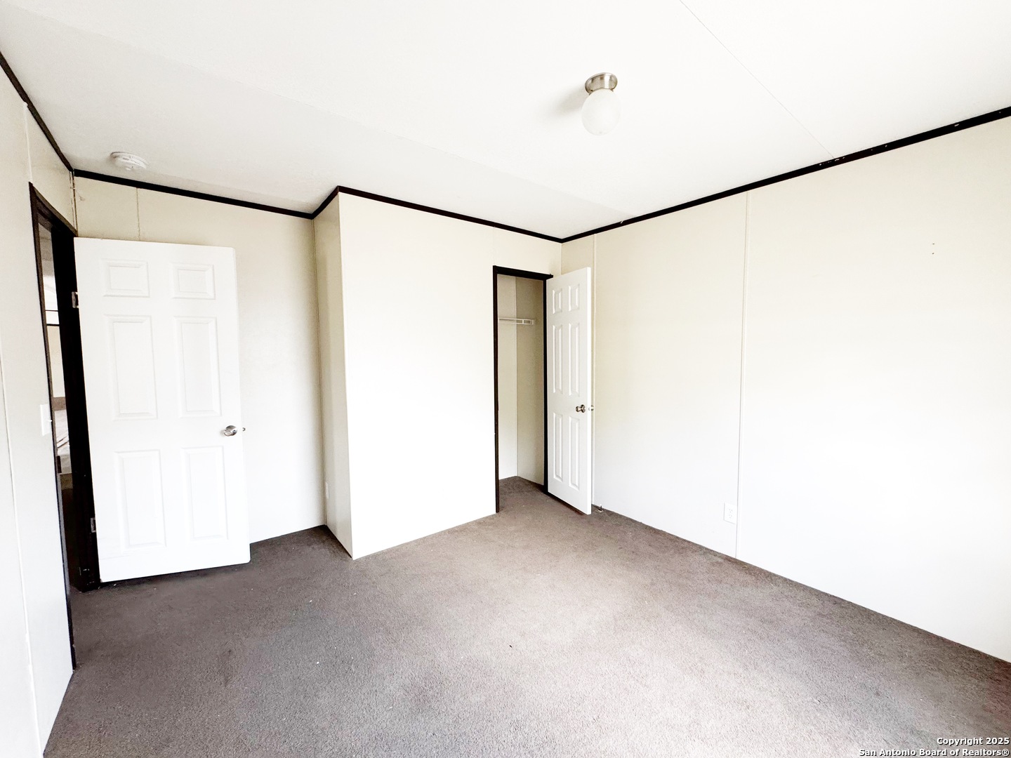 808 Pecan Street Jourdanton, TX 78026 - Photo 11 of 17 a view of an empty room