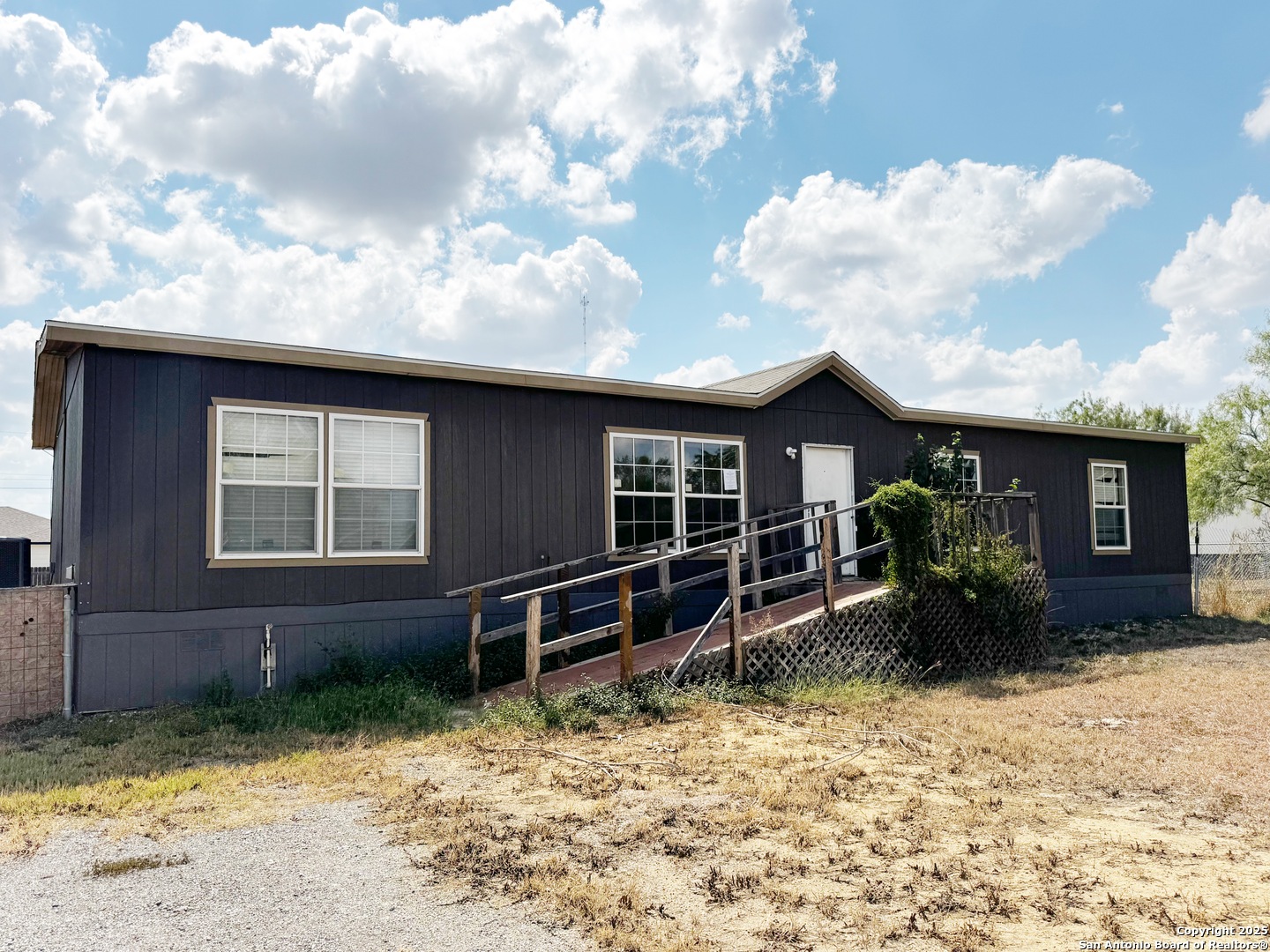 808 Pecan Street Jourdanton, TX 78026 - Photo 17 of 17 a front view of a house with garden