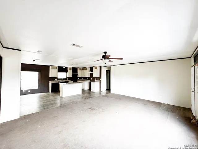 a view of a kitchen with furniture and a kitchen