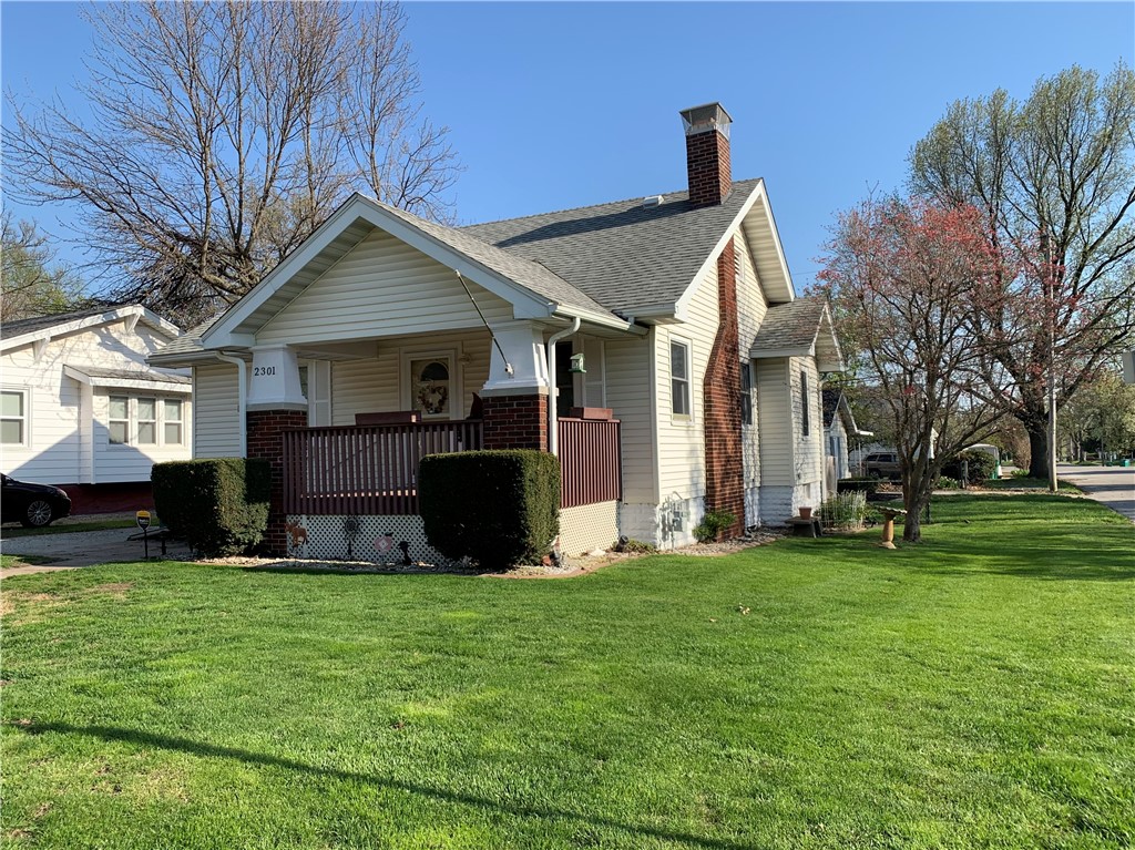 2301 East Wood Street Decatur, IL 62521 - Photo 1 of 17 a view of a house with a yard