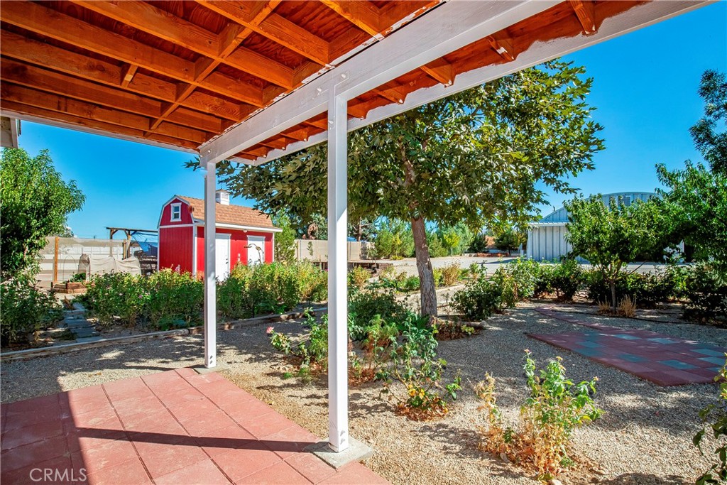 9642 East Ave R 14 Littlerock, CA 93543 - Photo 22 of 66 a view of a backyard with a patio
