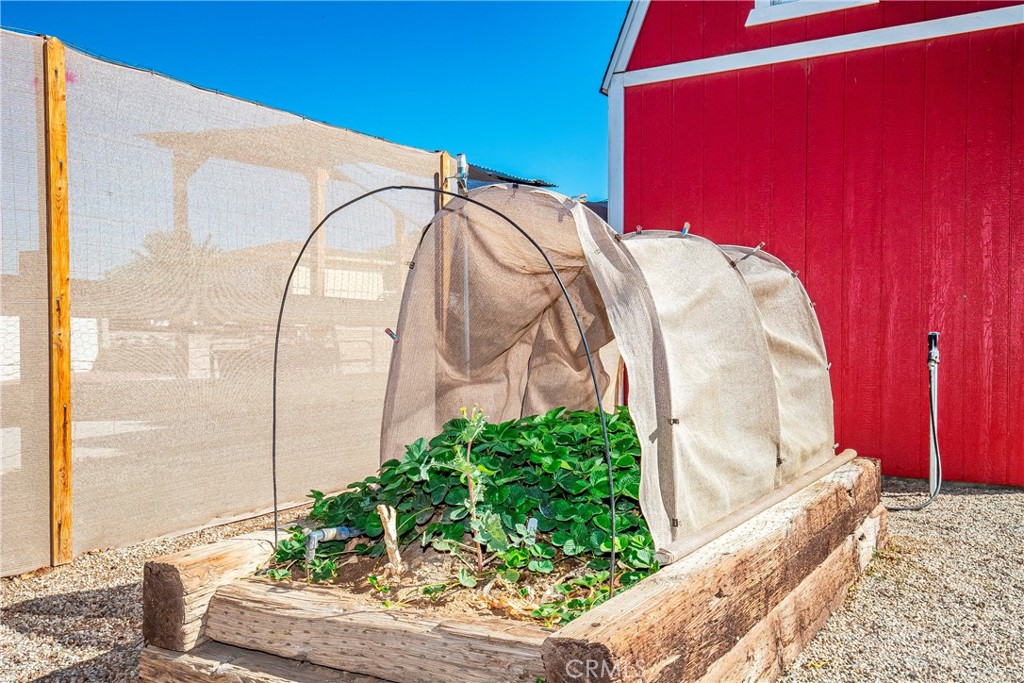 9642 East Ave R 14 Littlerock, CA 93543 - Photo 34 of 66 a view of a balcony with potted plants