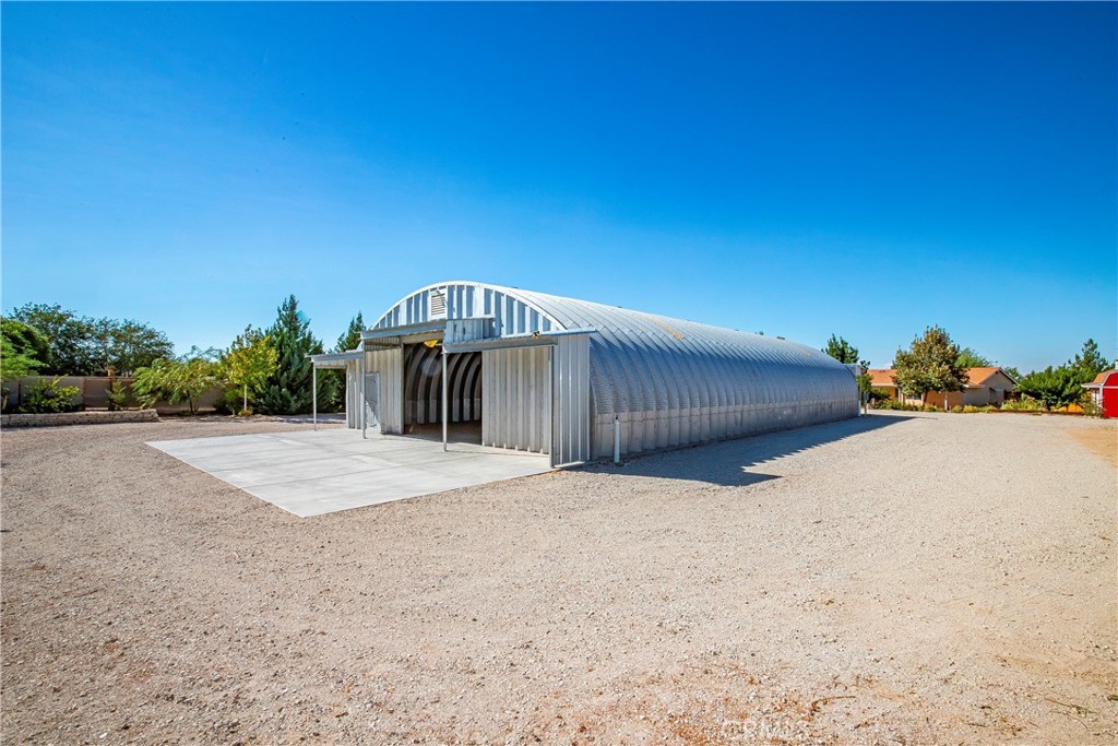9642 East Ave R 14 Littlerock, CA 93543 - Photo 40 of 66 a view of a backyard of a house