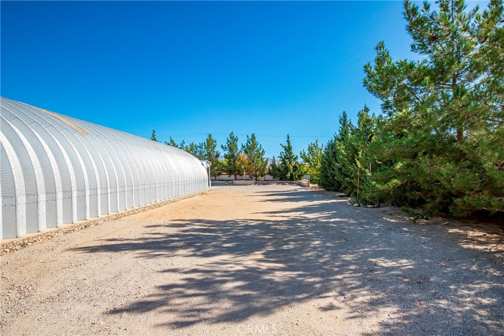 9642 East Ave R 14 Littlerock, CA 93543 - Photo 43 of 66 a view of a road with a yard
