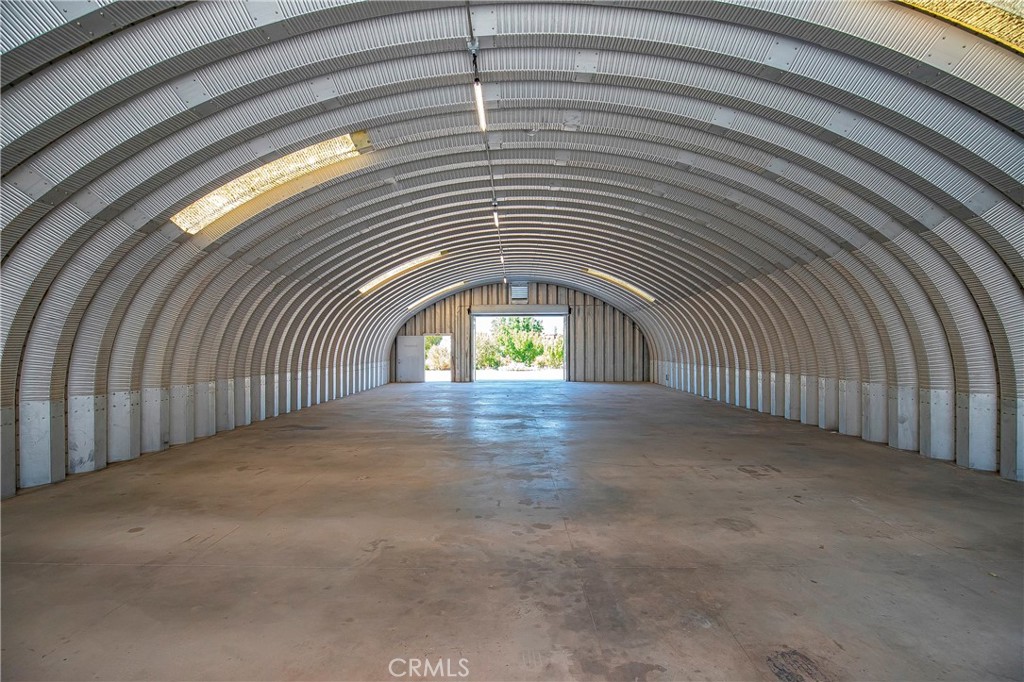 9642 East Ave R 14 Littlerock, CA 93543 - Photo 47 of 66 a view of a hallway with a chandelier