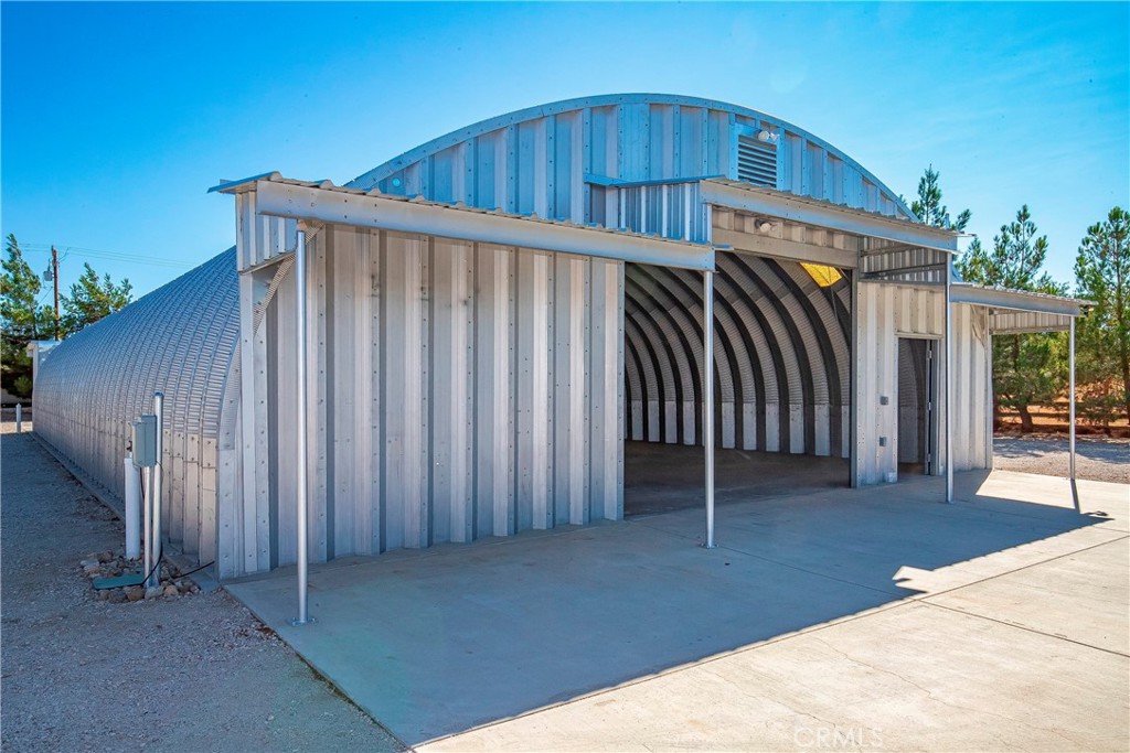 9642 East Ave R 14 Littlerock, CA 93543 - Photo 50 of 66 a view of a house with wooden floor and fence