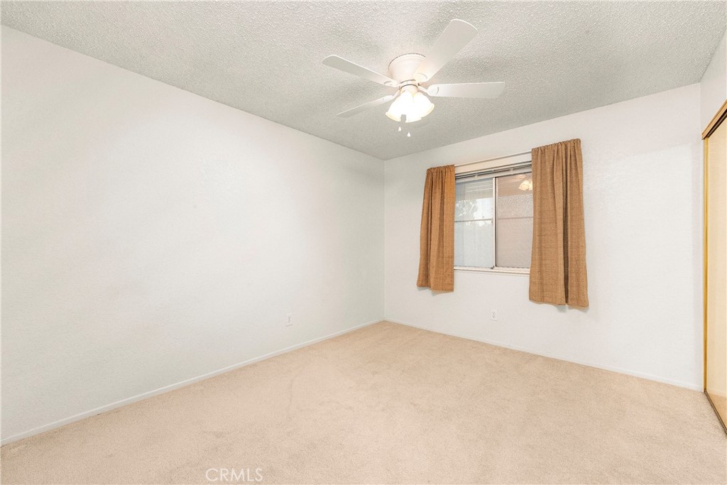 9642 East Ave R 14 Littlerock, CA 93543 - Photo 60 of 66 an empty room with windows and fan
