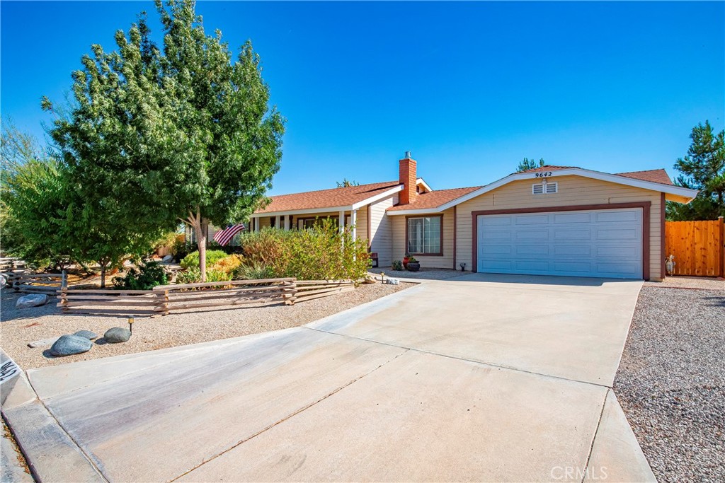9642 East Ave R 14 Littlerock, CA 93543 - Photo 6 of 66 a front view of a house with garage and parking