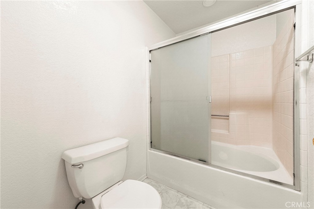 9642 East Ave R 14 Littlerock, CA 93543 - Photo 63 of 66 a white toilet sitting next to a bath tub