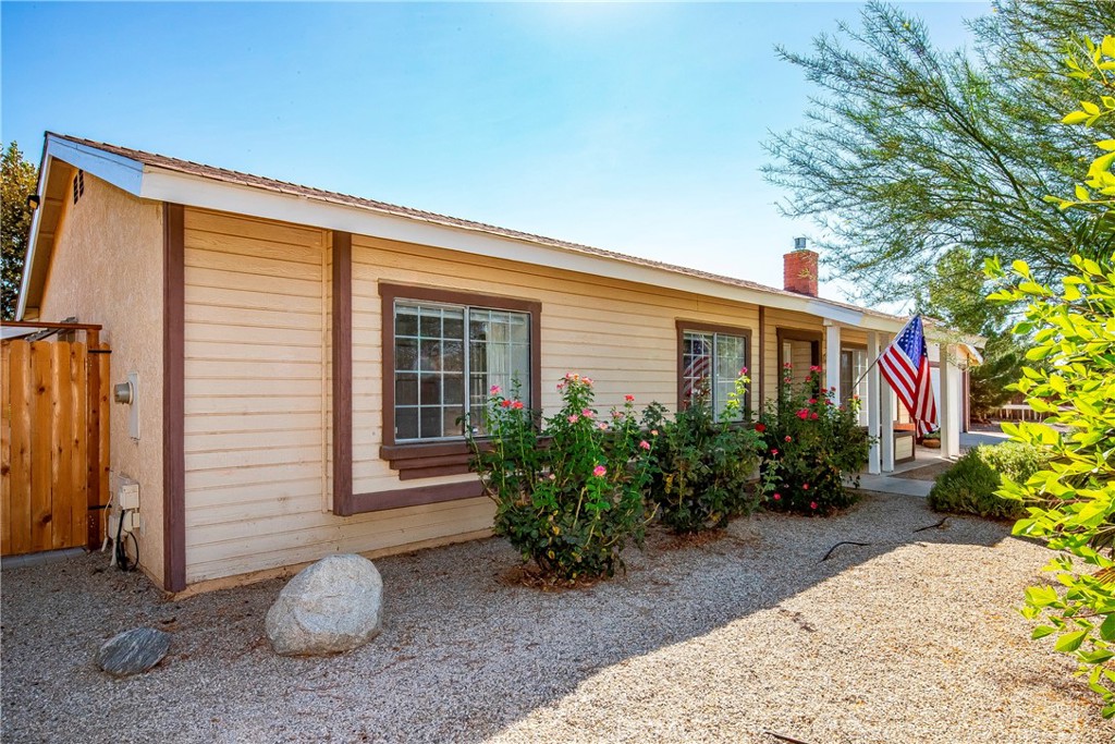 9642 East Ave R 14 Littlerock, CA 93543 - Photo 8 of 66 a view of a house with potted plants