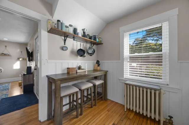 a view of a room and wooden floor