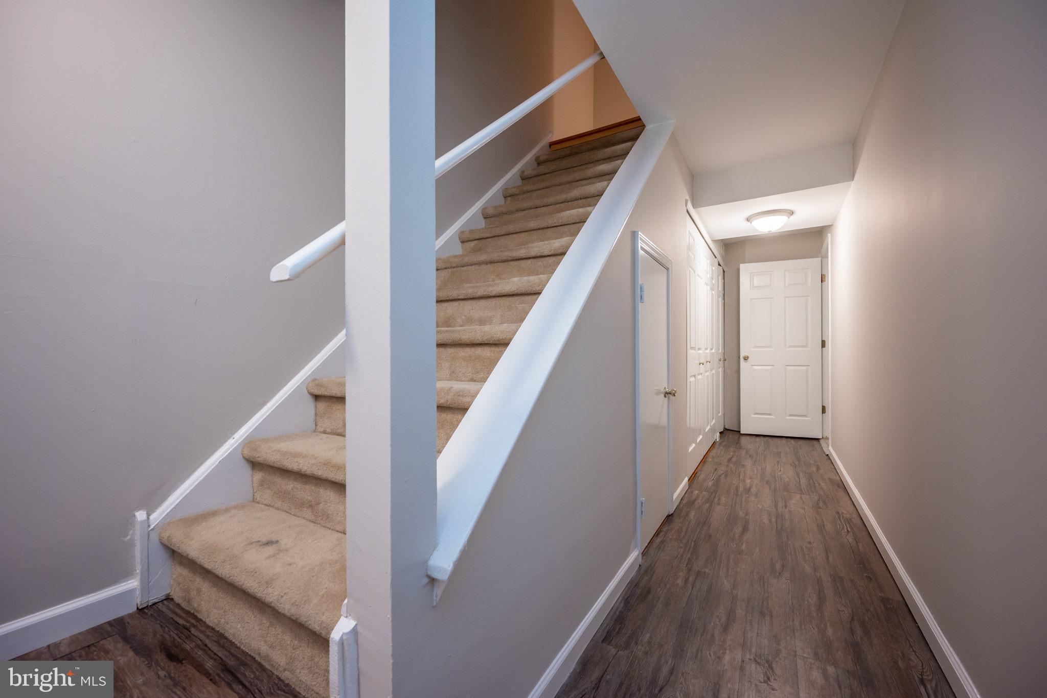 358 New Market Court Chesterbrook, PA 19087 - Photo 15 of 24 Lowerl Level Stairs and Hallway