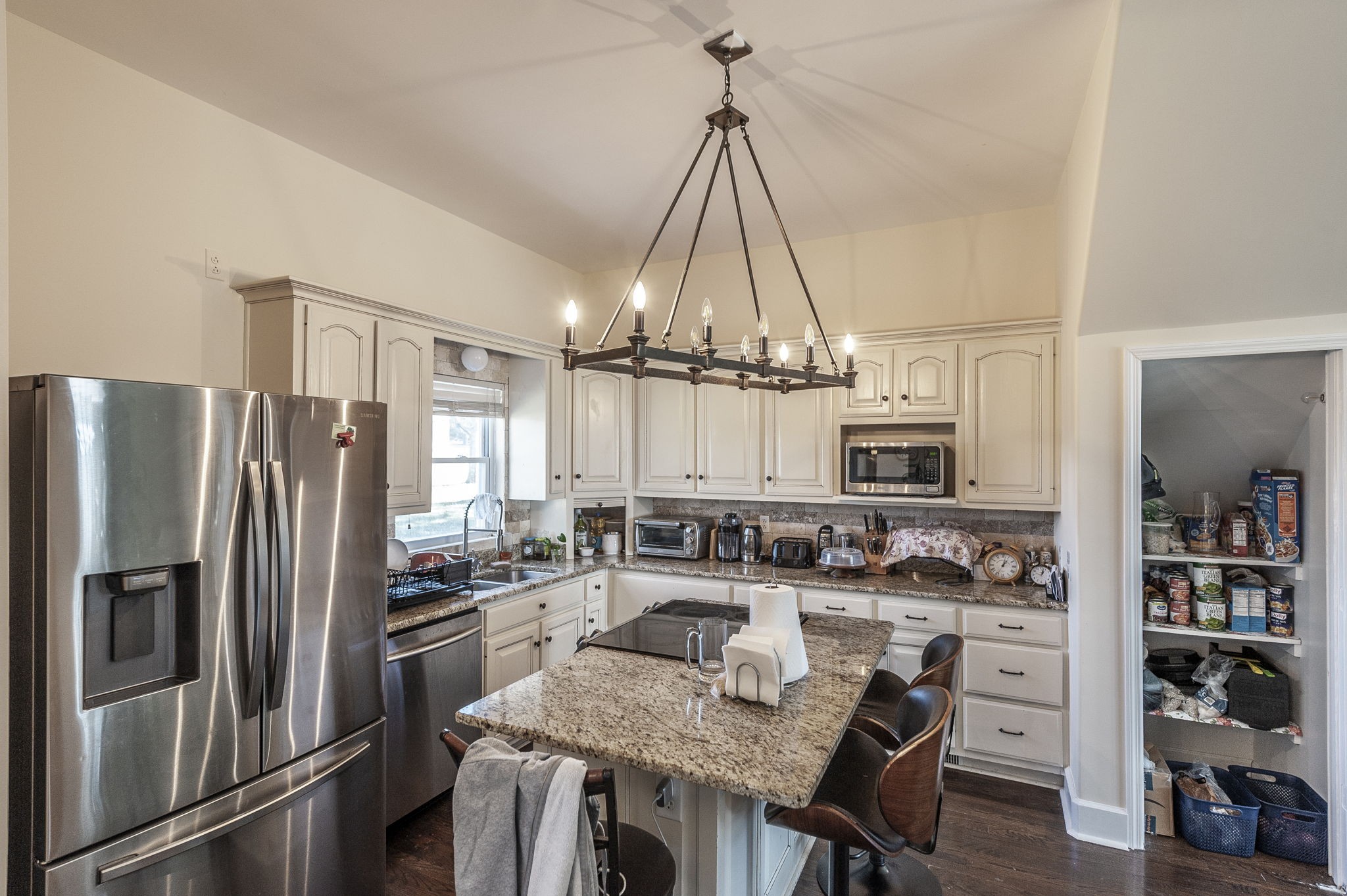 414 B Rock Springs Road Castalian Springs, TN 37031 - Photo 16 of 79 a kitchen with kitchen island a counter and a refrigerator