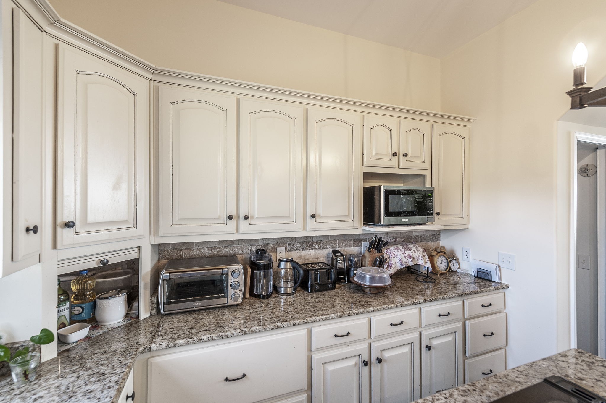 414 B Rock Springs Road Castalian Springs, TN 37031 - Photo 18 of 79 a kitchen with granite countertop white cabinets and sink