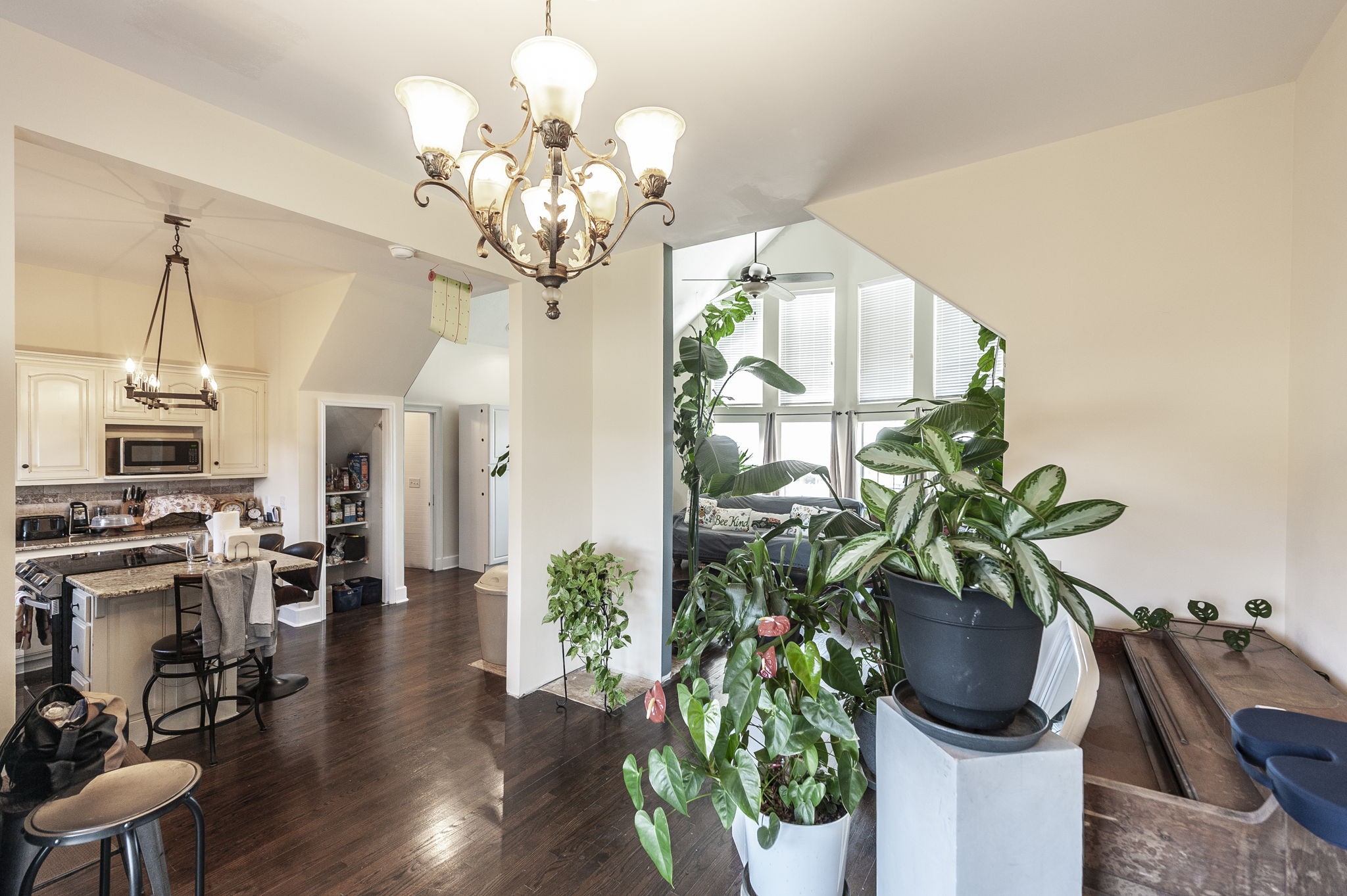 414 B Rock Springs Road Castalian Springs, TN 37031 - Photo 20 of 79 a vase of flowers sitting on a table with wooden floor