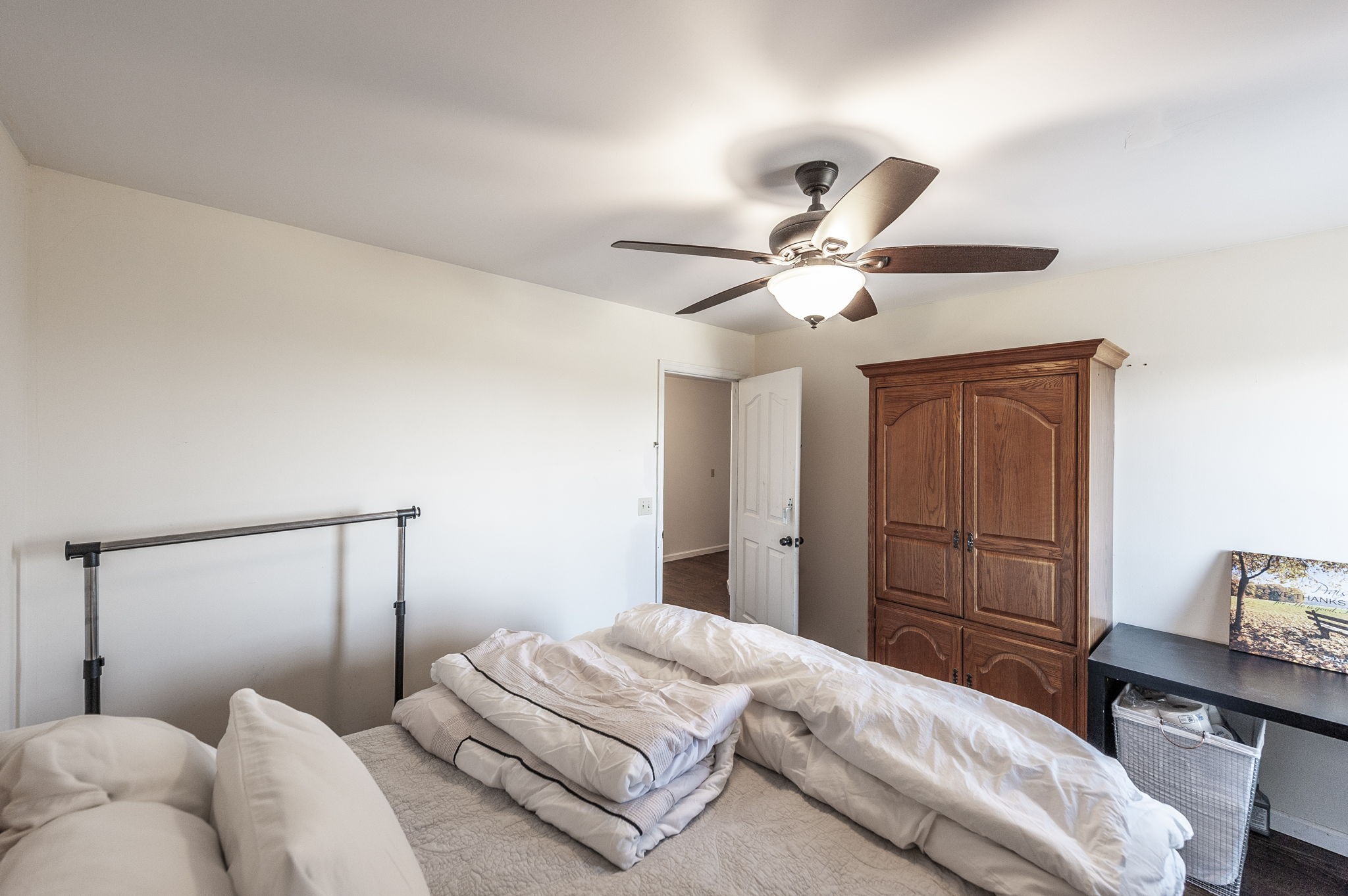 414 B Rock Springs Road Castalian Springs, TN 37031 - Photo 23 of 79 a bedroom with a bed and a chandelier
