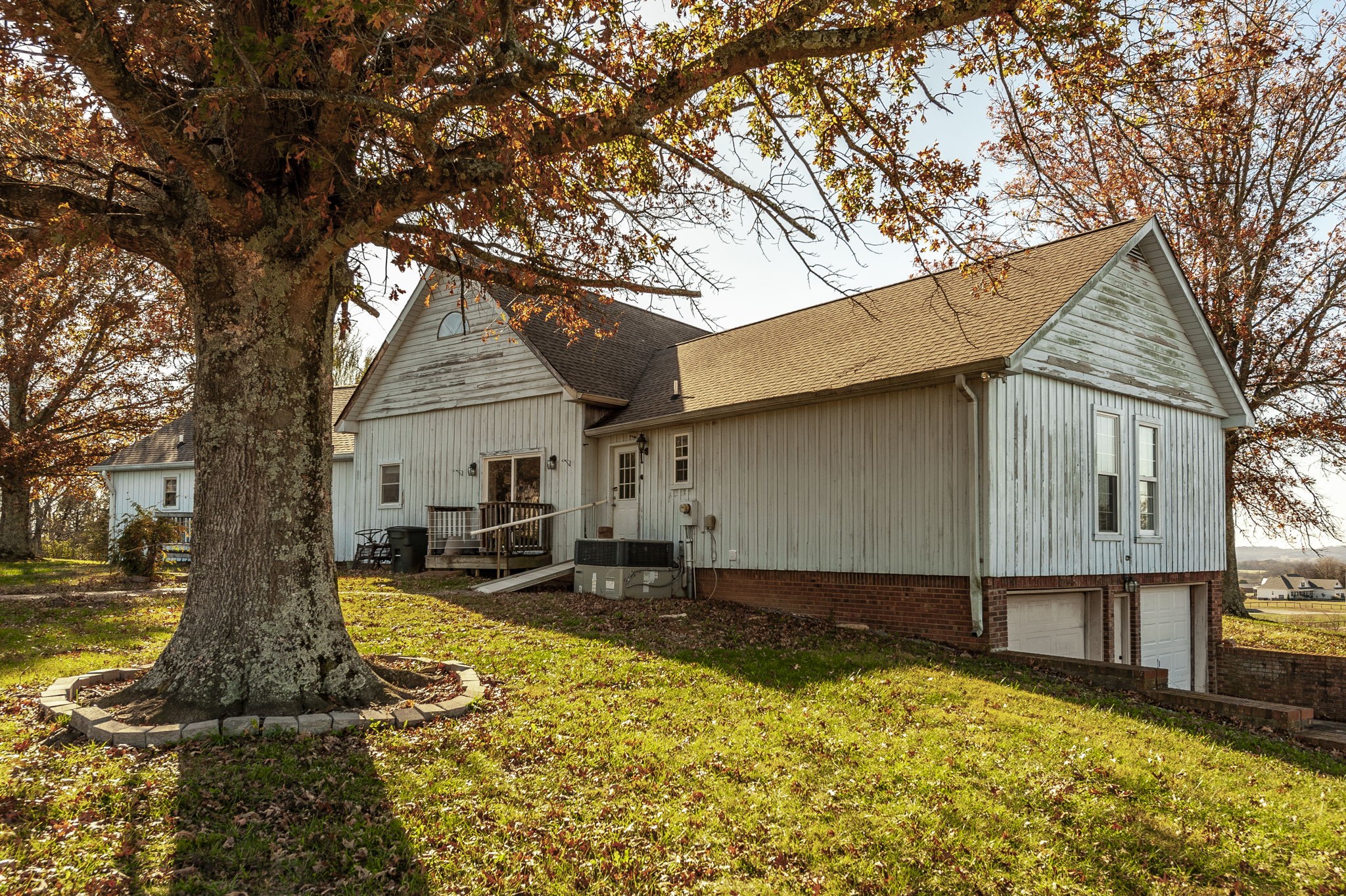 414 B Rock Springs Road Castalian Springs, TN 37031 - Photo 53 of 79 a front view of house with yard and trees in the background