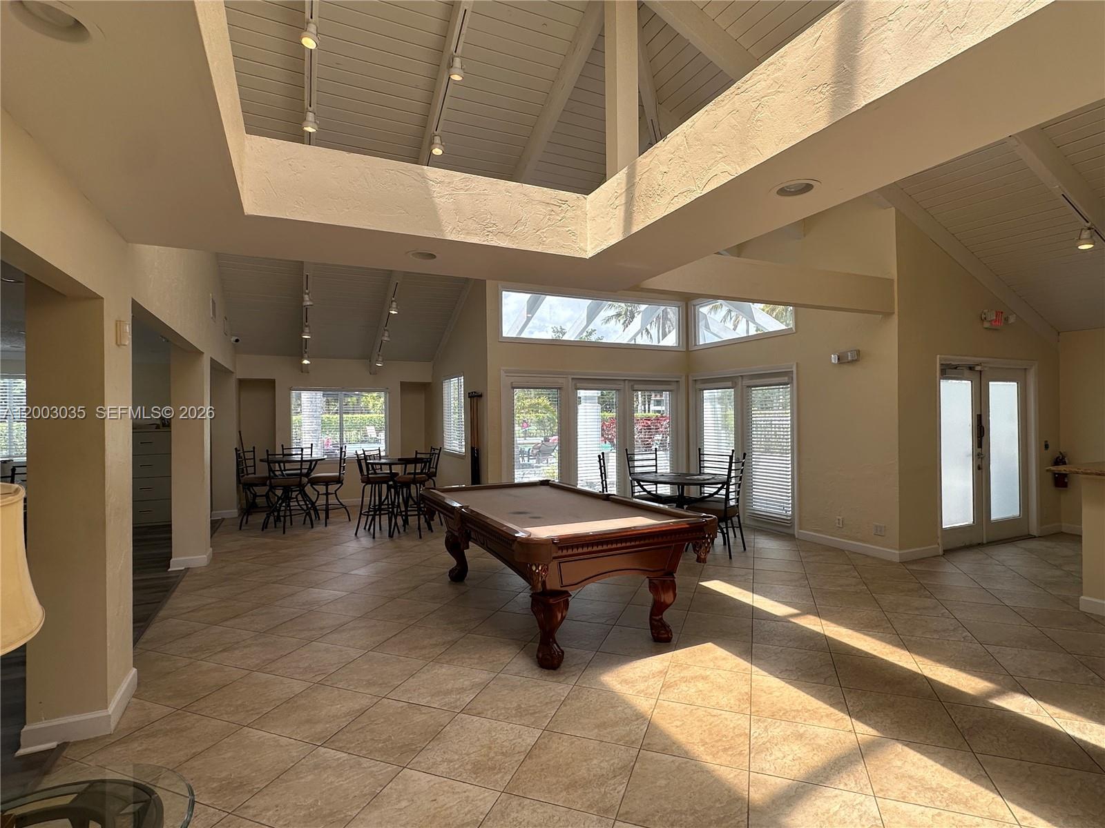 731 Lyons Road, Unit 16203 Coconut Creek, FL 33063 - Photo 13 of 14 a lobby with furniture and window