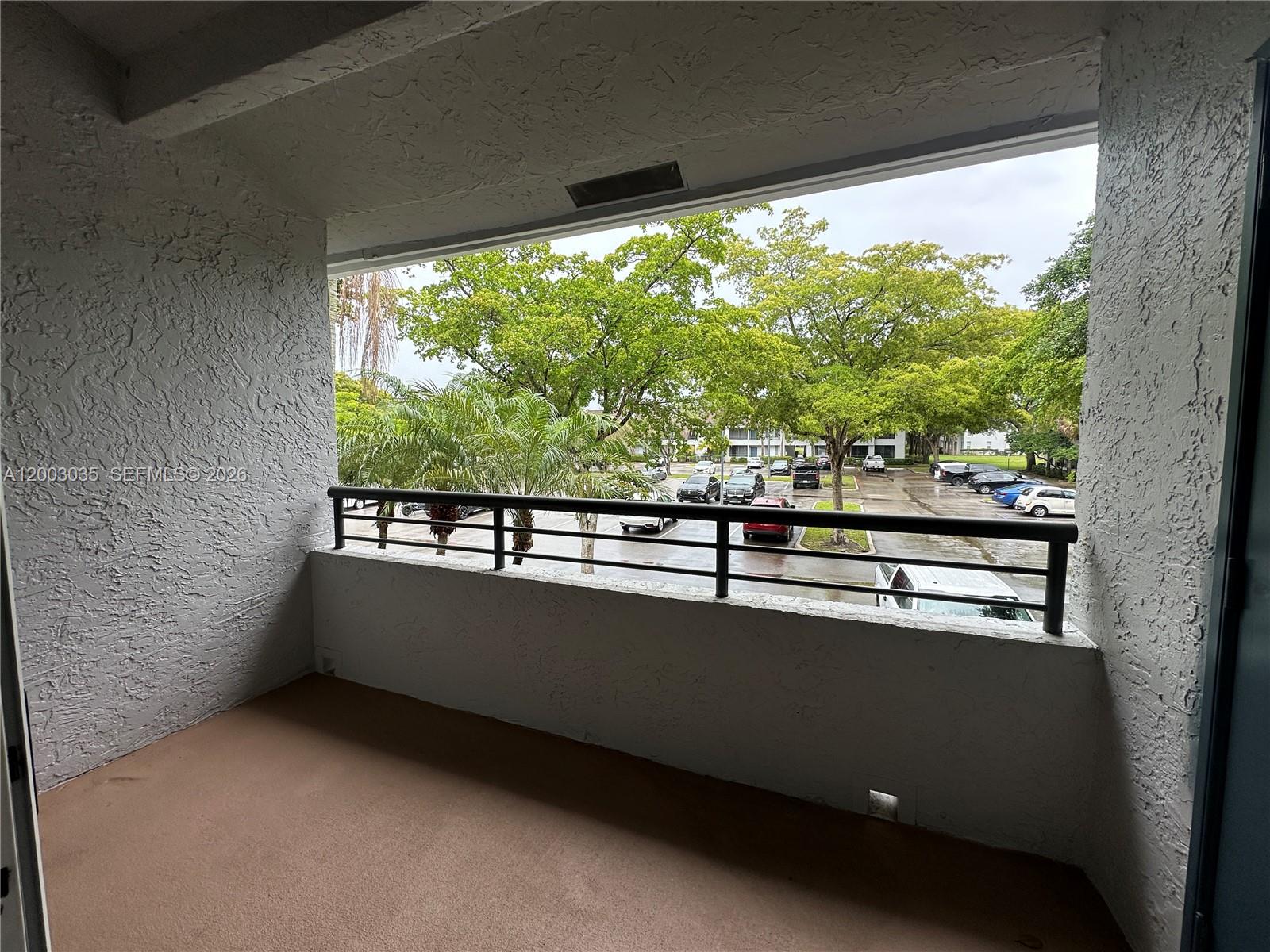 731 Lyons Road, Unit 16203 Coconut Creek, FL 33063 - Photo 10 of 14 a view of a balcony with an outdoor space