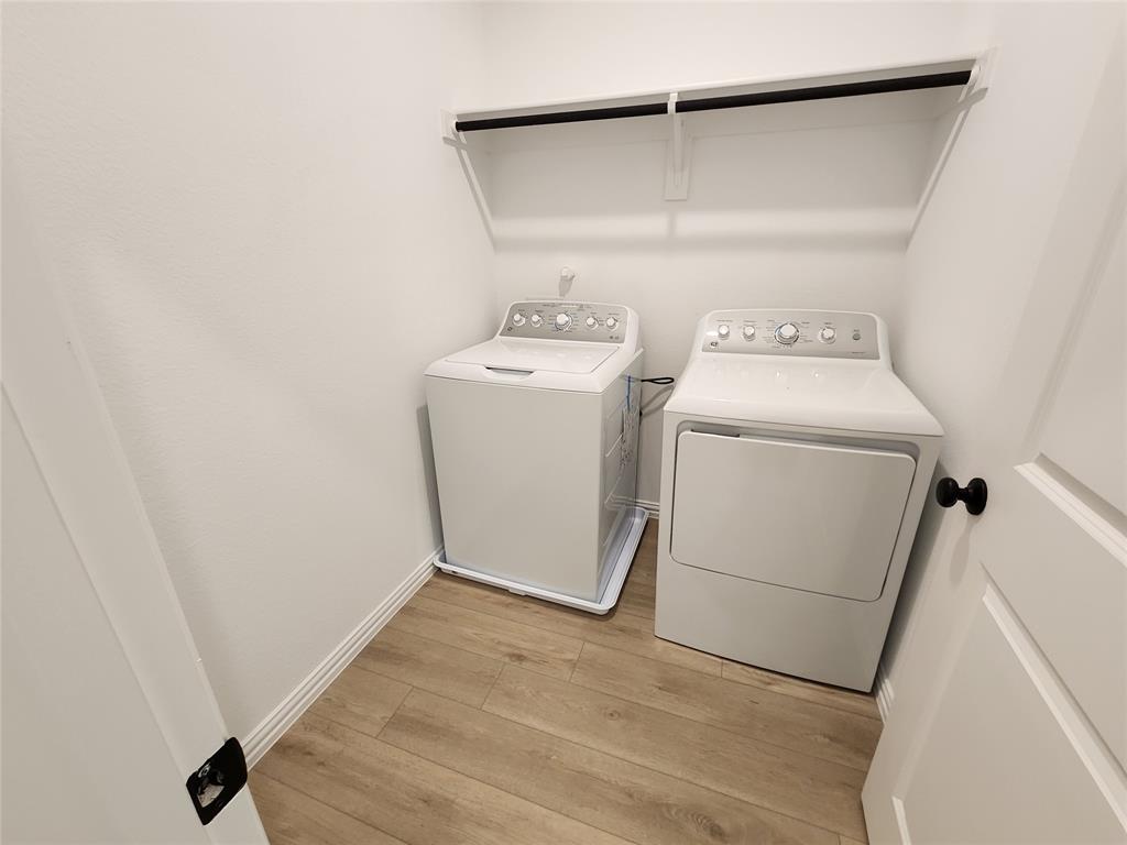 632 Blue Rdg Drive Mansfield, TX 76063 - Photo 14 of 16 Laundry room featuring light wood-style floors and washer and dryer