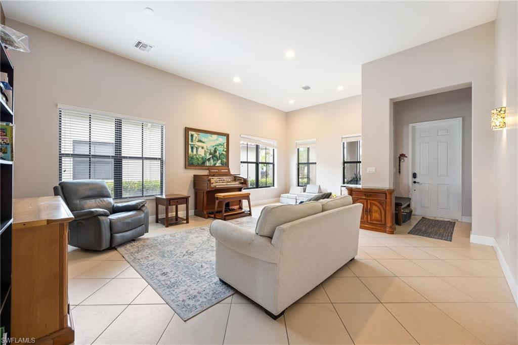 5116 Salerno Street Ave Maria, FL 34142 - Photo 5 of 36 Living room with light tile patterned floors and recessed lighting