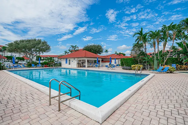 a view of swimming pool with chairs
