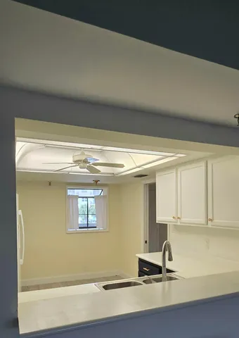 a view of a kitchen with a sink