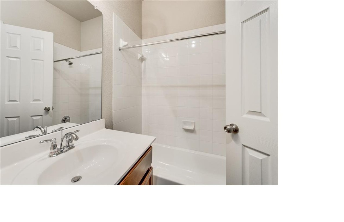 14815 Avery Ranch Boulevard, Unit 3203 Austin, TX 78717 - Photo 20 of 26 a bathroom with a sink a shower and a mirror