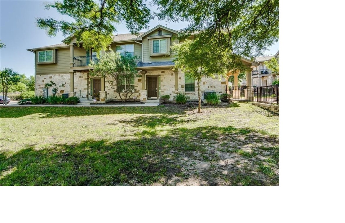 14815 Avery Ranch Boulevard, Unit 3203 Austin, TX 78717 - Photo 2 of 26 a front view of a house with a yard