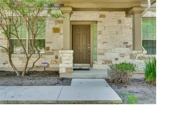 a stone house with outdoor space
