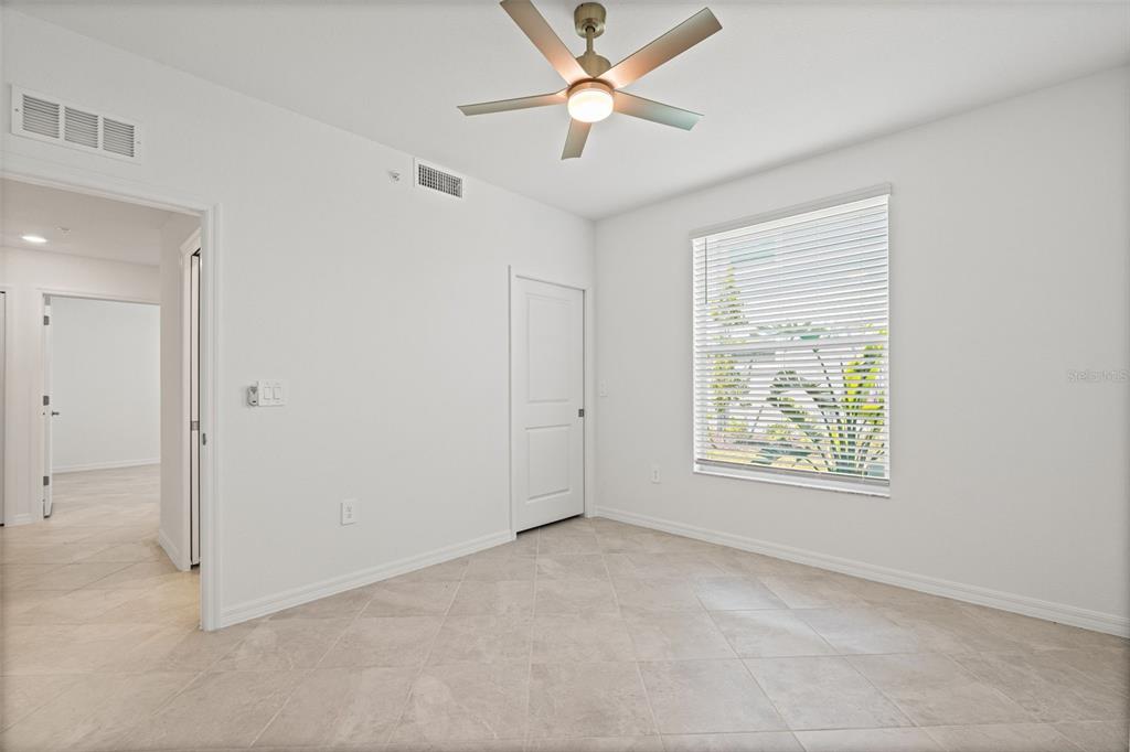 19007 Scallop Loop, Unit 108 Lakewood Ranch, FL 34211 - Photo 19 of 59 a view of an empty room with a window