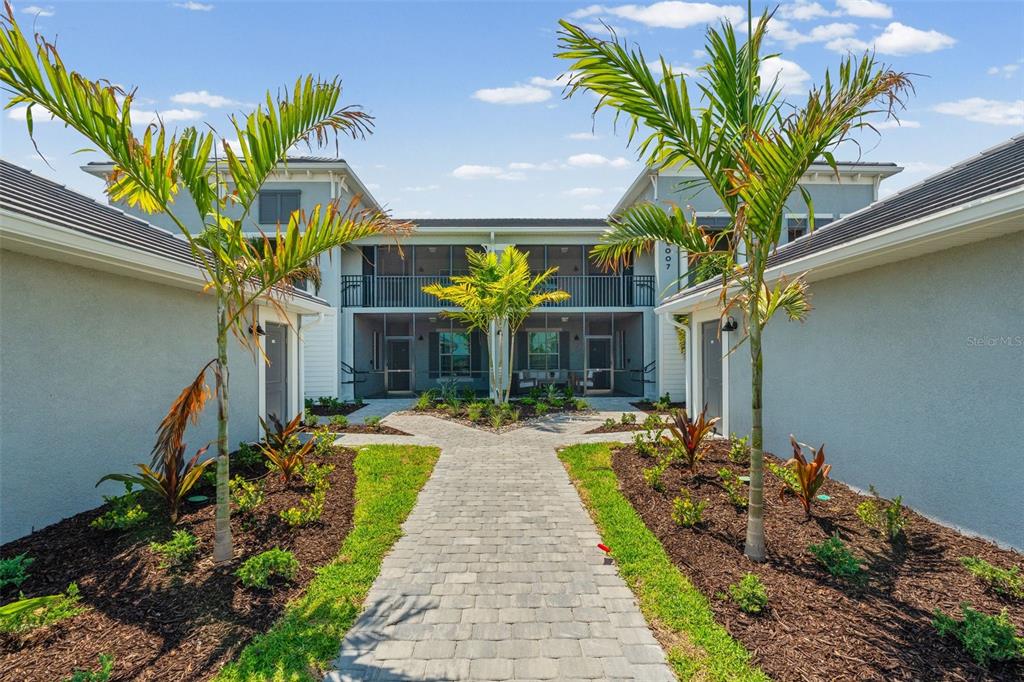 19007 Scallop Loop, Unit 108 Lakewood Ranch, FL 34211 - Photo 3 of 59 a view of a house with a fountain in a yard