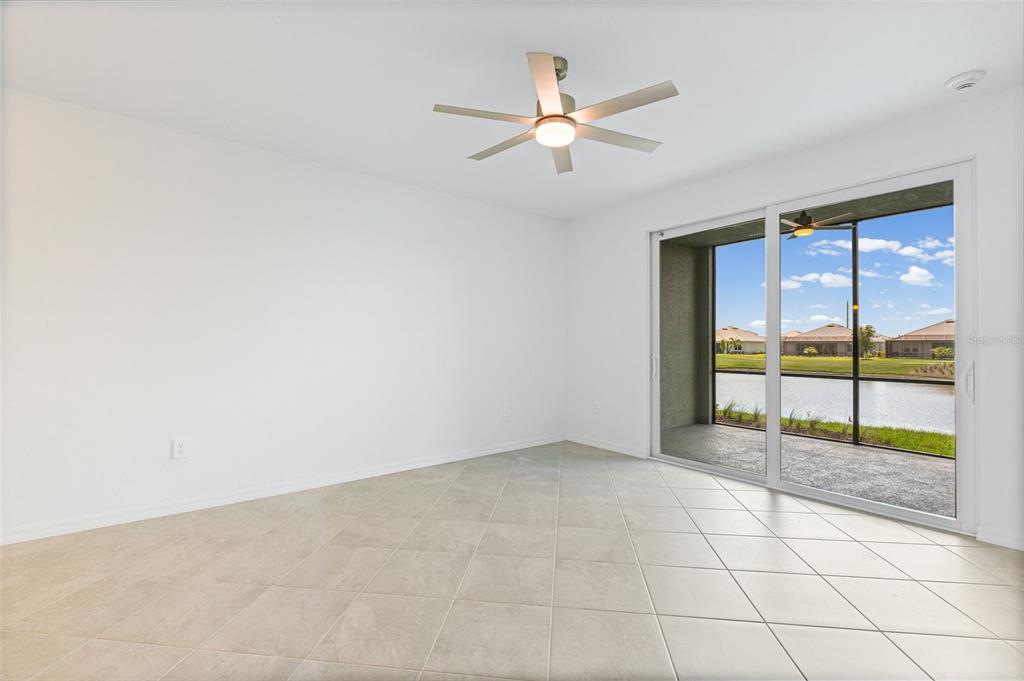 19007 Scallop Loop, Unit 108 Lakewood Ranch, FL 34211 - Photo 34 of 59 en empty room with window and a ceiling fan