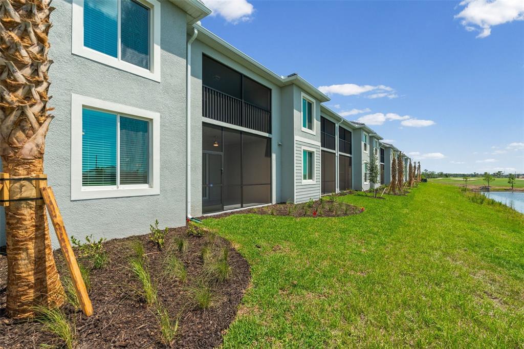 19007 Scallop Loop, Unit 108 Lakewood Ranch, FL 34211 - Photo 43 of 59 a house view with a garden space