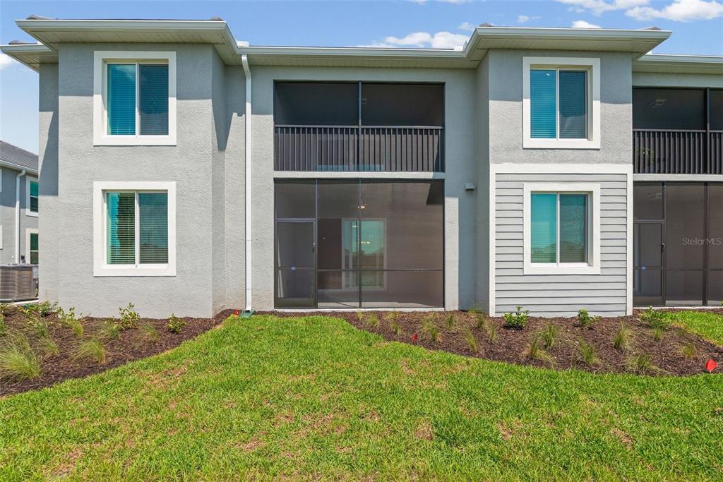 19007 Scallop Loop, Unit 108 Lakewood Ranch, FL 34211 - Photo 46 of 59 a front view of a house with a yard