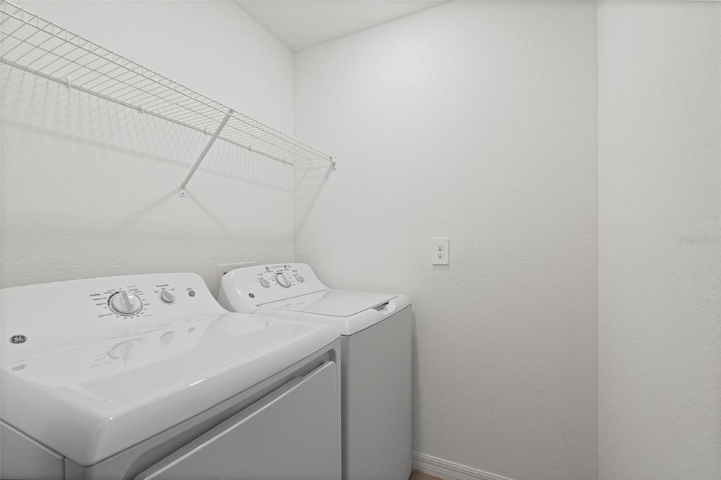 19007 Scallop Loop, Unit 108 Lakewood Ranch, FL 34211 - Photo 47 of 59 a utility room with dryer and washer