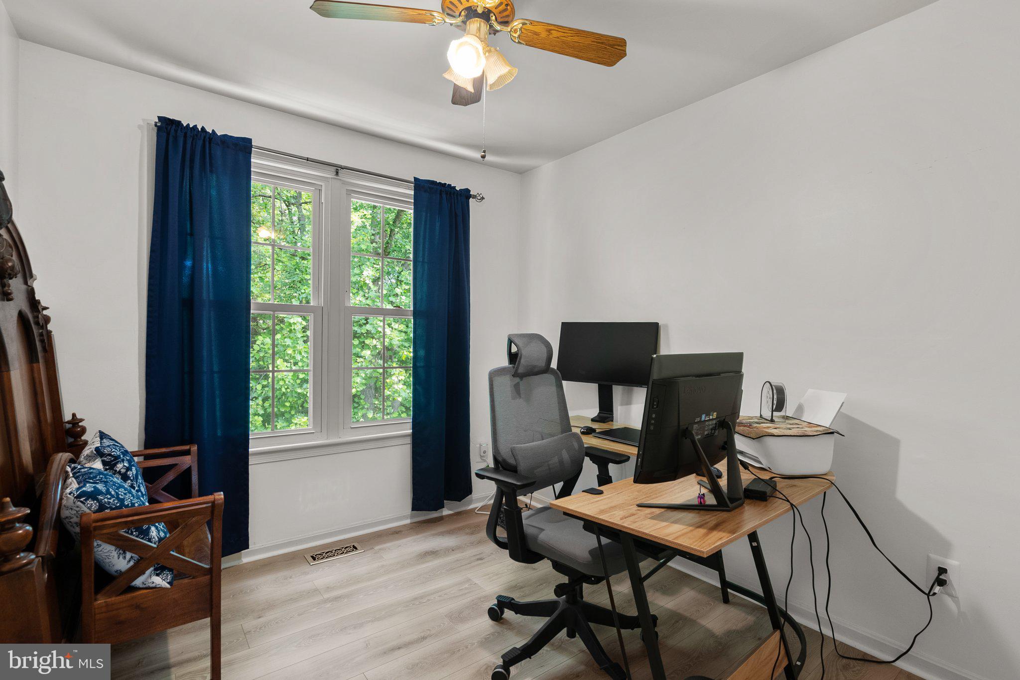 20249 Maple Leaf Court Montgomery Village, MD 20886 - Photo 17 of 30 a view of a workspace with furniture and a window