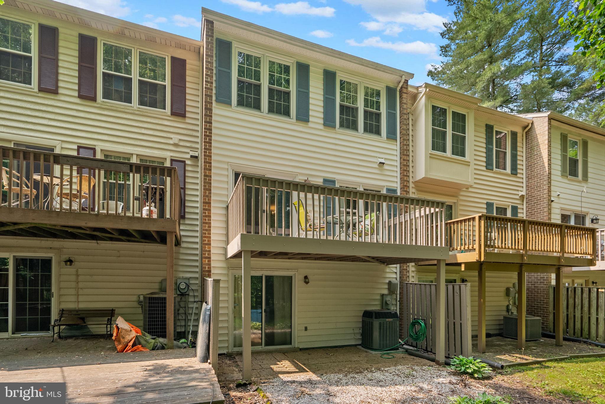 20249 Maple Leaf Court Montgomery Village, MD 20886 - Photo 30 of 30 a view of a brick house with many windows