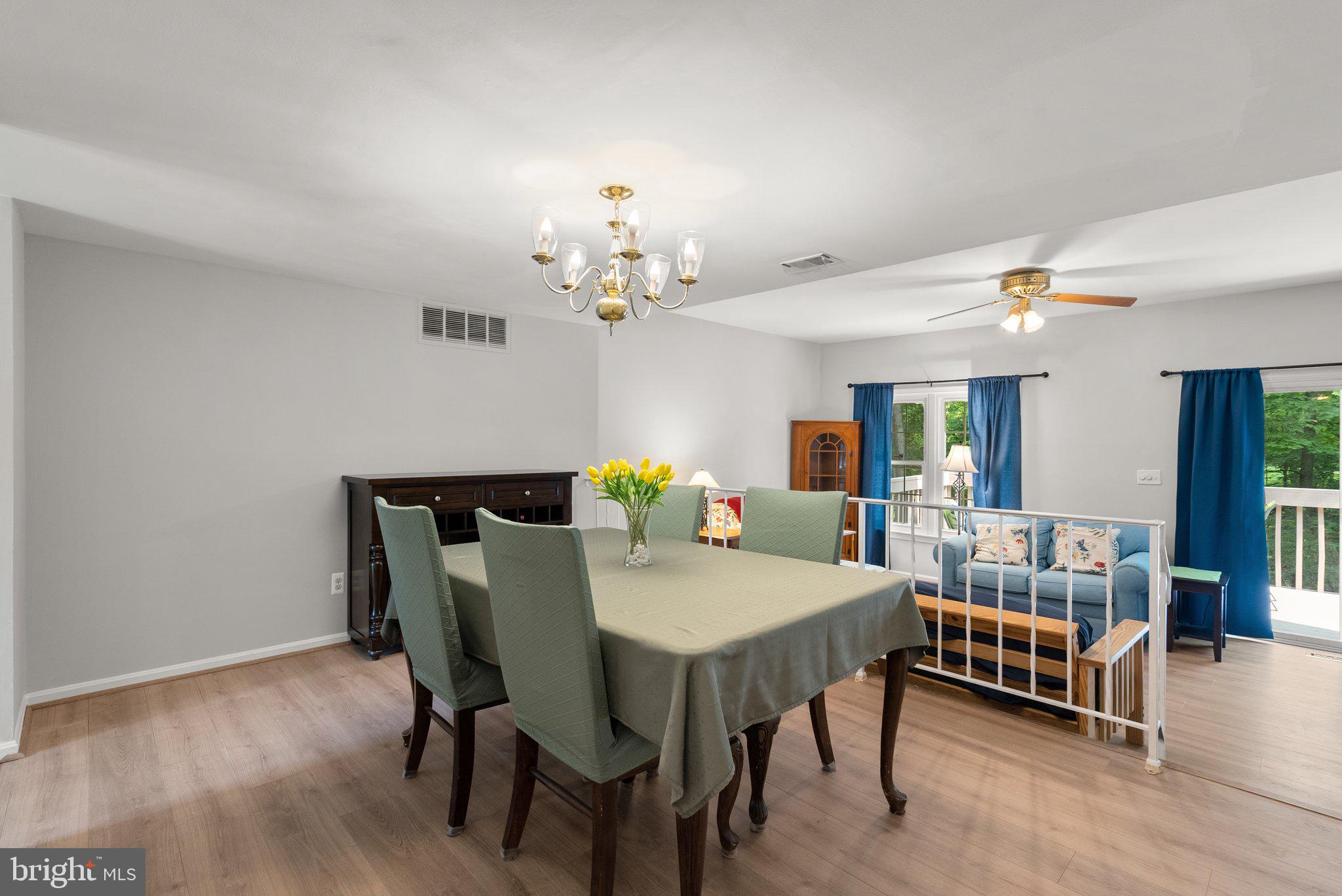 20249 Maple Leaf Court Montgomery Village, MD 20886 - Photo 6 of 30 a view of a dining room with furniture and wooden floor