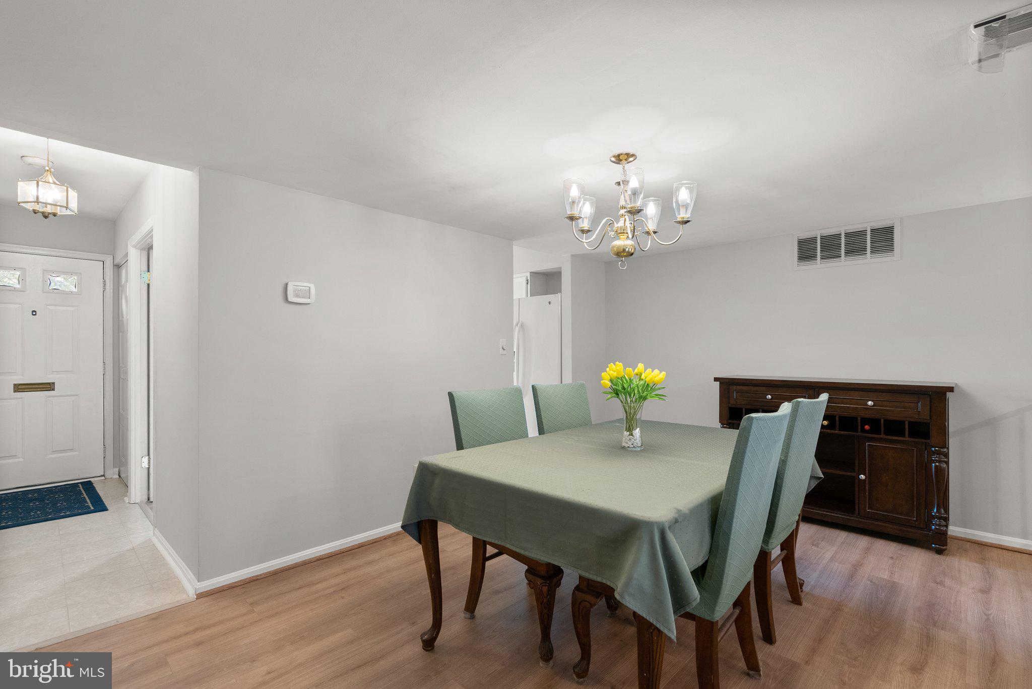 20249 Maple Leaf Court Montgomery Village, MD 20886 - Photo 7 of 30 a dining room with furniture and wooden floor