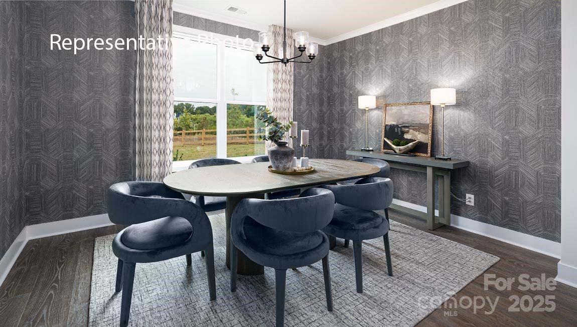 3044 Canvasback Way Indian Trail, NC 28079 - Photo 14 of 43 a view of a dining room with furniture window and wooden floor