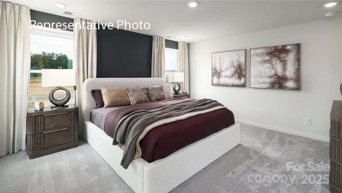 3044 Canvasback Way Indian Trail, NC 28079 - Photo 23 of 43 a bedroom with a bed and dresser