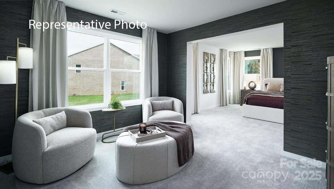 3044 Canvasback Way Indian Trail, NC 28079 - Photo 26 of 43 a living room with furniture and a large window