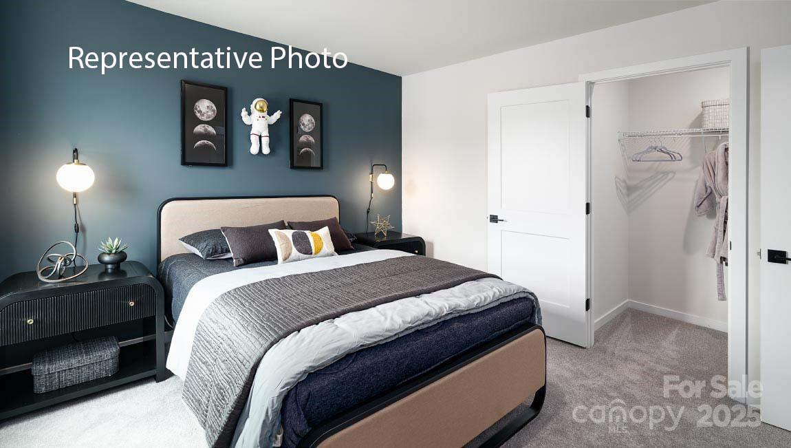 3044 Canvasback Way Indian Trail, NC 28079 - Photo 35 of 43 a bedroom with a bed and a painting on the wall