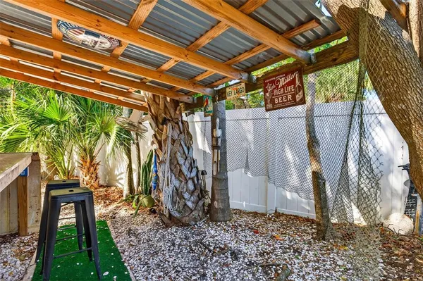 a view of a backyard with a tree