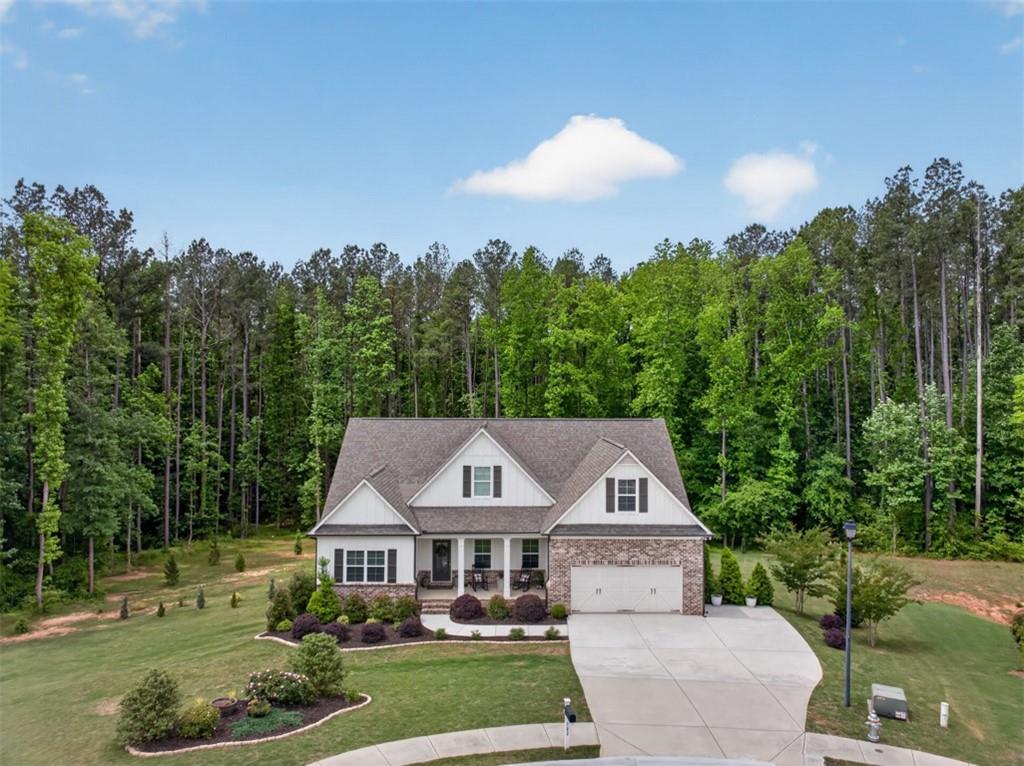 163 Hewett Road Pendergrass, GA 30567 - Photo 6 of 82 a aerial view of a house with yard and green space