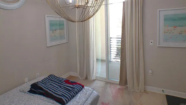 a very nice looking dining room with a large center island and a chandelier